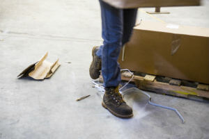 worker in warehouse about to trip